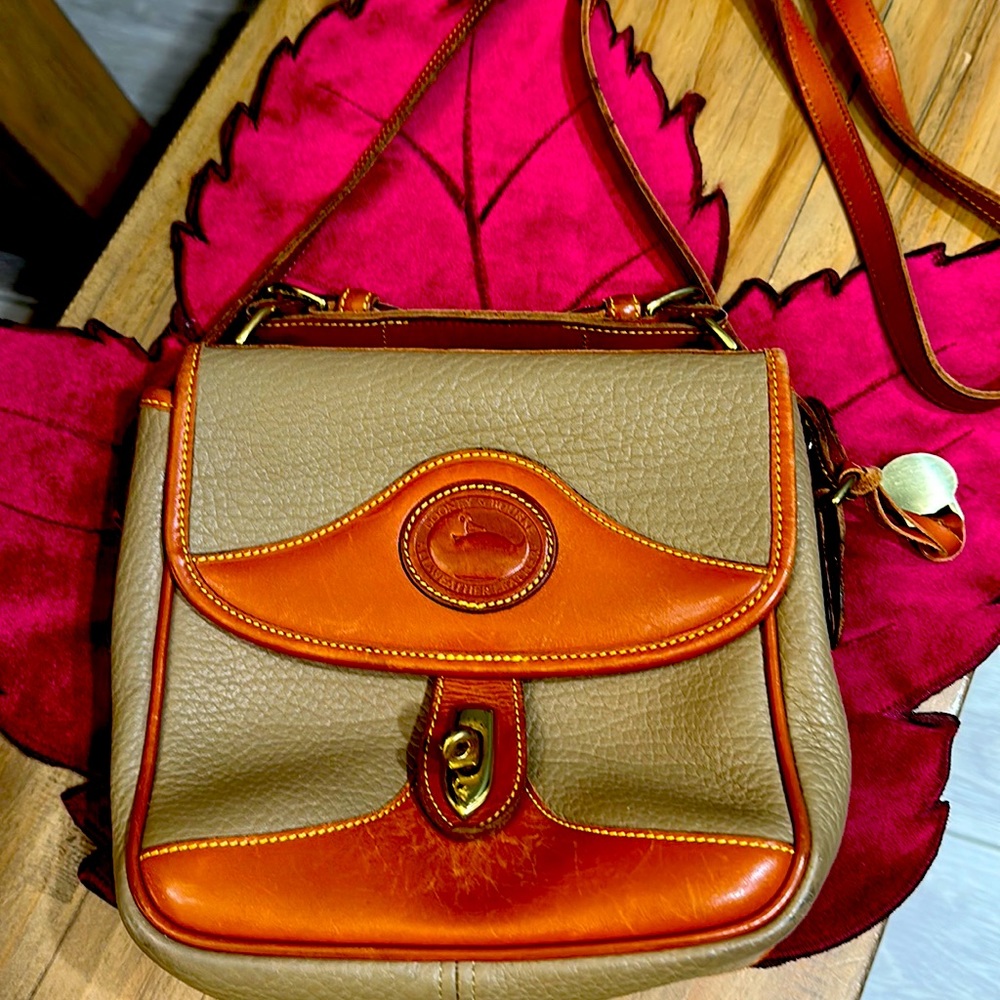 Tan with brown leather accents .classic duck badge. All weather leather.